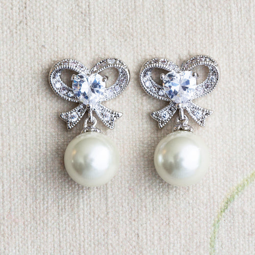 Misha pearl and crystal bow earrings